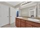 Bathroom with double sinks, granite countertop, and access to shower room at 6626 Seahorse Reef St, Las Vegas, NV 89149