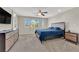 Bedroom with carpet, ceiling fan, natural light and furniture at 6626 Seahorse Reef St, Las Vegas, NV 89149