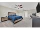 Bedroom with carpet, ceiling fan, bed, and television at 6626 Seahorse Reef St, Las Vegas, NV 89149