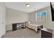 Bedroom featuring a bed, desk, and a window providing natural light at 6626 Seahorse Reef St, Las Vegas, NV 89149