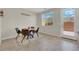 Bright breakfast nook features a table with four chairs, natural light from the window, and a door to the outside at 6626 Seahorse Reef St, Las Vegas, NV 89149