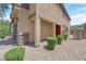 Stylish exterior with a covered entry, stone accents, manicured shrubs, and a paver driveway at 6626 Seahorse Reef St, Las Vegas, NV 89149