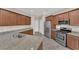 Open kitchen featuring stainless steel appliances, granite countertops, ample cabinet space, and a modern design at 6626 Seahorse Reef St, Las Vegas, NV 89149