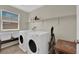Laundry room featuring a washer, dryer and a shelf at 6626 Seahorse Reef St, Las Vegas, NV 89149