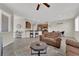 Spacious living room seamlessly connecting to the kitchen, complete with stylish furniture and an open layout at 6626 Seahorse Reef St, Las Vegas, NV 89149