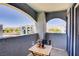 Picturesque balcony featuring a table set with wine against a scenic backdrop at 6955 N Durango Dr # 3089, Las Vegas, NV 89149