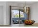 View of a balcony with an outside dining set and open sliding glass doors at 6955 N Durango Dr # 3089, Las Vegas, NV 89149