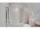 Bathroom featuring shower, toilet, and single sink vanity with decorative mirror at 6955 N Durango Dr # 3089, Las Vegas, NV 89149