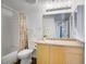 A well-lit bathroom with a shower and tub, a white toilet, and a sink and mirror at 6955 N Durango Dr # 3089, Las Vegas, NV 89149