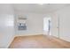 A bright bedroom with carpet and window and a door to another room at 6955 N Durango Dr # 3089, Las Vegas, NV 89149