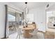 Charming dining area with sliding glass doors that lead to a balcony at 6955 N Durango Dr # 3089, Las Vegas, NV 89149
