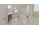Bright bathroom with double vanity and soaking tub with shower; bedroom visible at 7525 Campbell Ranch Ave, Las Vegas, NV 89179