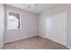 Bedroom features carpet floors, a ceiling fan, and sliding door closet at 7525 Campbell Ranch Ave, Las Vegas, NV 89179