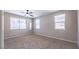 Bedroom featuring neutral colored walls, carpet flooring, ceiling fan, and large windows with blinds at 7525 Campbell Ranch Ave, Las Vegas, NV 89179