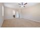 Bedroom features carpet flooring, a ceiling fan, and ensuite bathroom and closet at 7525 Campbell Ranch Ave, Las Vegas, NV 89179