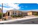 Charming single-story home with a well-manicured lawn and a cozy front porch at 7525 Campbell Ranch Ave, Las Vegas, NV 89179