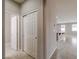 Hallway with tile flooring leading to kitchen and living area, featuring a closet with sliding doors at 7525 Campbell Ranch Ave, Las Vegas, NV 89179