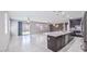 Spacious kitchen with granite countertops, stainless steel appliances, and an expansive island at 7525 Campbell Ranch Ave, Las Vegas, NV 89179