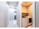 Convenient laundry room includes a new washer and dryer at 7525 Campbell Ranch Ave, Las Vegas, NV 89179