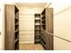 This walk-in closet features custom shelving and a convenient layout for optimal organization at 7525 Campbell Ranch Ave, Las Vegas, NV 89179