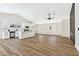 Bright, open-concept living and kitchen area with hardwood floors and recessed lighting at 811 Spyglass Ln, Las Vegas, NV 89107