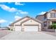 Inviting home with a two-car garage and low-maintenance desert landscaping at 82 Autumn Day St, Henderson, NV 89012