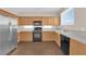 Charming kitchen featuring stainless appliances, light oak cabinets, and great natural lighting at 82 Autumn Day St, Henderson, NV 89012