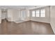 Open living room boasts wood floors, neutral paint, and ample natural light at 82 Autumn Day St, Henderson, NV 89012