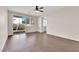 Bright living room with wood floors and sliding glass doors to outdoor space at 82 Autumn Day St, Henderson, NV 89012