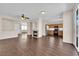 Open-concept living area featuring fireplace, modern floors, and seamlessly connects to the kitchen at 82 Autumn Day St, Henderson, NV 89012