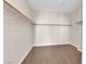 Walk-in closet with wood floors and multiple shelves for storage at 82 Autumn Day St, Henderson, NV 89012