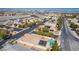 Aerial view of property with pool and solar panels, near the city at 8266 Lincoln Valley St, Las Vegas, NV 89123