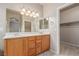 Bathroom with double sink vanity, a large mirror, and a closet at 8266 Lincoln Valley St, Las Vegas, NV 89123