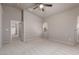 Large carpeted bedroom with ceiling fan and neutral color palette at 8266 Lincoln Valley St, Las Vegas, NV 89123