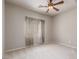 Neutral bedroom featuring a ceiling fan and natural light at 8266 Lincoln Valley St, Las Vegas, NV 89123