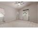 Spacious bedroom with neutral walls, plush carpeting, and natural light at 8266 Lincoln Valley St, Las Vegas, NV 89123