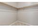 Walk-in closet with wooden shelf and light-colored walls at 8266 Lincoln Valley St, Las Vegas, NV 89123