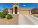 Inviting single-story home with a neutral color palette, arched entry, and a well-kept front yard at 8266 Lincoln Valley St, Las Vegas, NV 89123
