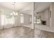 Spacious living area with ceramic tile flooring, fireplace, neutral walls, and large windows for natural lighting at 8266 Lincoln Valley St, Las Vegas, NV 89123