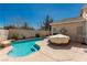 Backyard features a kidney shaped pool and patio at 8266 Lincoln Valley St, Las Vegas, NV 89123