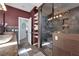 Modern bathroom features a walk-in shower, dual sink vanity, and tile accents at 8268 Nelson Ridge Ln, Las Vegas, NV 89178