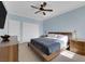 Cozy bedroom with a ceiling fan, carpeted floors, and dual closets at 8268 Nelson Ridge Ln, Las Vegas, NV 89178