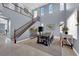 Elegant dining room with soaring ceilings, staircase, and ample natural light at 8268 Nelson Ridge Ln, Las Vegas, NV 89178