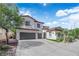 Charming two-story home with three-car garage and beautiful desert landscaping at 8268 Nelson Ridge Ln, Las Vegas, NV 89178