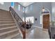 Grand entryway with staircase, high ceilings, and large windows with natural light at 8268 Nelson Ridge Ln, Las Vegas, NV 89178
