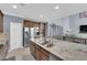 Modern kitchen with stainless steel appliances and granite countertops, ideal for cooking and entertaining at 8268 Nelson Ridge Ln, Las Vegas, NV 89178