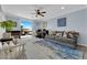 Bright living area with a ceiling fan, desk space, and balcony access at 8268 Nelson Ridge Ln, Las Vegas, NV 89178