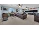 Spacious living room with fitness equipment, entertainment center, and comfortable seating at 8268 Nelson Ridge Ln, Las Vegas, NV 89178