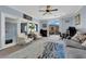 Living room featuring lots of natural light, comfortable seating and a ceiling fan at 8268 Nelson Ridge Ln, Las Vegas, NV 89178