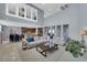 Spacious living room with soaring ceilings, open layout, and seamless flow to kitchen at 8268 Nelson Ridge Ln, Las Vegas, NV 89178